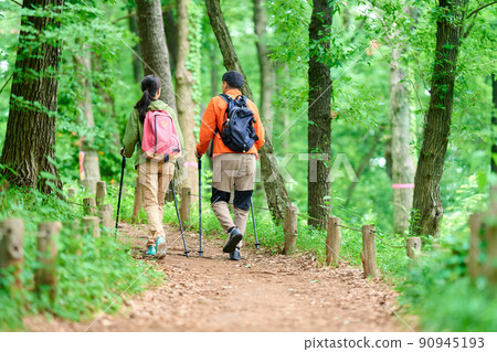 Senior couple walking in the mountains Senior couple walking in the mountains 90945193