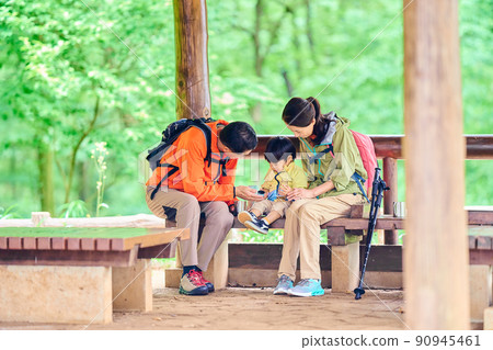 Senior couple resting at Azumaya with their 2-year-old grandson Senior couple resting at Azumaya with their 2-year-old grandson 90945461