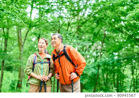 Senior couple walking in the mountains Senior couple walking in the mountains 90945567