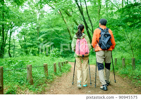 Senior couple walking in the mountains Senior couple walking in the mountains 90945575