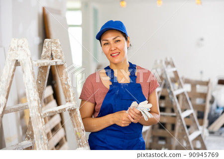 Portrait of smiling asian woman repairer Portrait of smiling asian woman repairer 90945769
