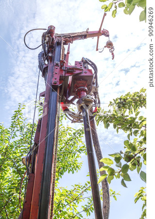 Water Well Drilling Rig. Modern rotary drilling rig drills well at home. Water Well Drilling Rig. Modern rotary drilling rig drills well at home. 90946269