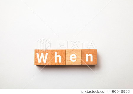 When character. when. Interrogative. Written on four wooden blocks. White letters. White background. When character. when. Interrogative. Written on four wooden blocks. White letters. White background. 90948993