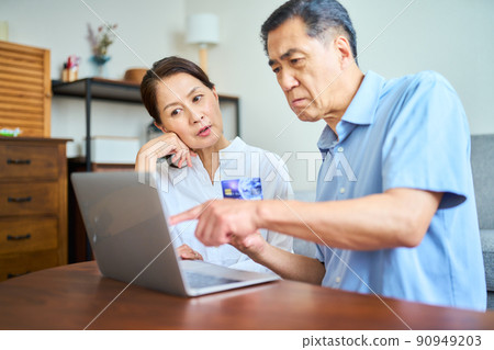 Senior couple shopping online Senior couple shopping online 90949203