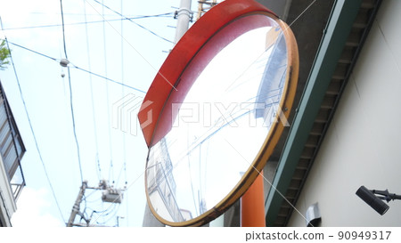 Safety mirror in a residential area Safety mirror in a residential area 90949317