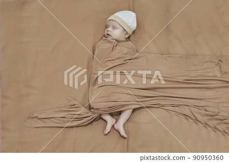 Newborn baby girl, sleeping on a blanket. Newborn baby girl, sleeping on a blanket. 90950360
