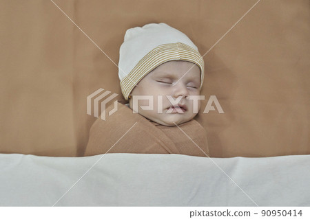 Newborn baby girl, sleeping on a blanket. Newborn baby girl, sleeping on a blanket. 90950414