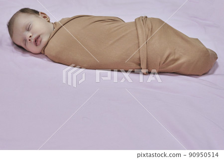 Newborn baby girl, sleeping on a blanket. 90950514