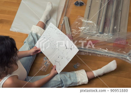 Instruction for furniture assembling in the female hands for self assembly. Instruction for furniture assembling in the female hands for self assembly. 90951880
