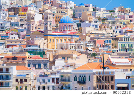 Ermoupolis town, Greece. A town on the side of a mountain. Houses and streets in Greek architecture. Ermoupolis town, Greece. A town on the side of a mountain. Houses and streets in Greek architecture. 90952238