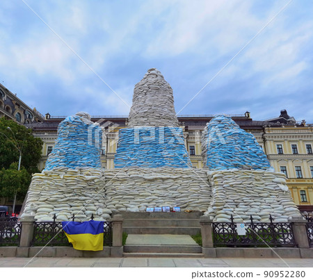 Kyiv, Ukraine, May 27, 2022: Covered monument to Princess Olga, St. Andrew the Apostle, educators Cyril and Methodius with sandbags to protect the historical heritage from Russian attack Kyiv, Ukraine, May 27, 2022: Covered monument to Princess Olga, St. Andrew the Apostle, educators Cyril and Methodius with sandbags to protect the historical heritage from Russian attack 90952280