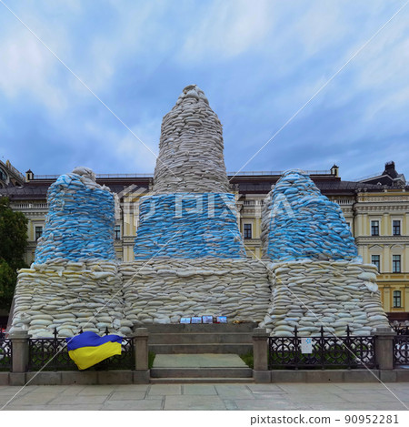 Kyiv, Ukraine, May 27, 2022: Covered monument to Princess Olga, St. Andrew the Apostle, educators Cyril and Methodius with sandbags to protect the historical heritage from Russian attack Kyiv, Ukraine, May 27, 2022: Covered monument to Princess Olga, St. Andrew the Apostle, educators Cyril and Methodius with sandbags to protect the historical heritage from Russian attack 90952281