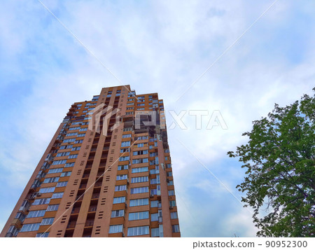 Kyiv, Ukraine - May 27, 2022: War of Russia against Ukraine. View of a civilian building damaged following a Russian rocket attack the city. Kyiv, Ukraine - May 27, 2022: War of Russia against Ukraine. View of a civilian building damaged following a Russian rocket attack the city. 90952300