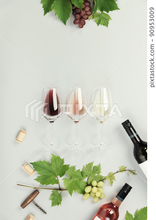 Flat-lay of red, rose and white wine in glasses on white background 90953009