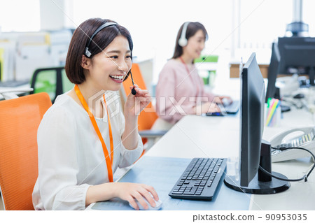 Call center operator receiving a call 90953035