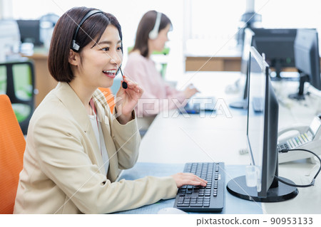 Call center operator receiving a call Call center operator receiving a call 90953133