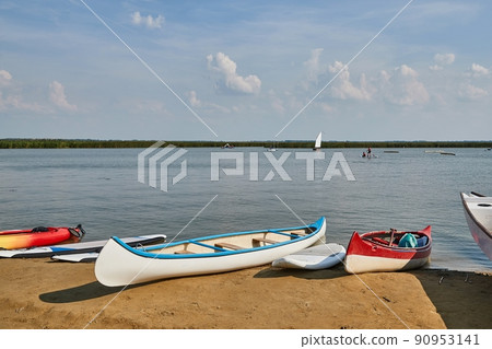 Canoes ans SUPs on the Lakeside 90953141