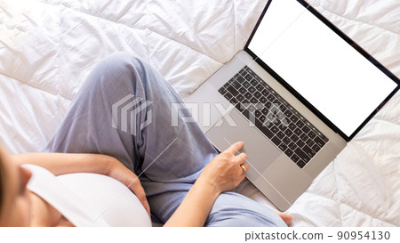 Pregnancy mockup app laptop. Mobile pregnancy online maternity notebook application. Pregnant mother using notebook mock up. Pregnancy, medicine, pharmaceutics, health care and people concept. 90954130