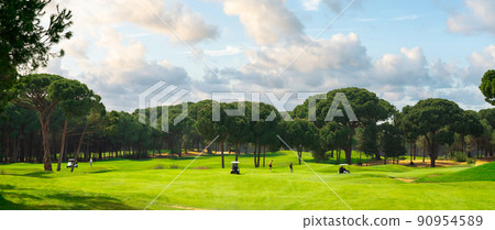Golf course panorama with beautiful sky. Landscape view of golf course in Turkey Belek Golf course panorama with beautiful sky. Landscape view of golf course in Turkey Belek 90954589