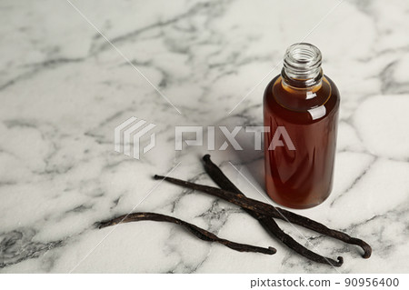Aromatic homemade vanilla extract on marble table. Space for text Aromatic homemade vanilla extract on marble table. Space for text 90956400