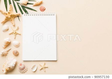 Blank writing book with summer beach accessories on background, copy space. Flat lay with copy space 90957130