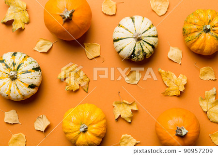 Autumn composition. Pattern made of dried leaves and other design accessories on table. Flat lay, top view Autumn composition. Pattern made of dried leaves and other design accessories on table. Flat lay, top view 90957209