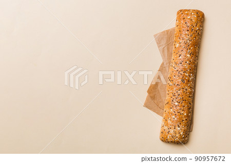 fresh crunchy french baguette on colored table. Top view Bakery products 90957672