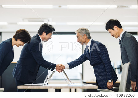 Business person shaking hands 90958266