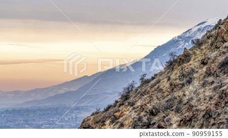 Pano Mountain in Provo Canyon Utah with stunning backdrop of sunset and cloudy sky 90959155