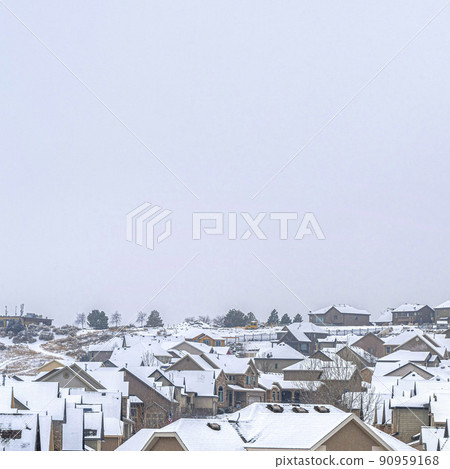 Square frame Big and beautiful houses with white roofs with the white cloudy sky Square frame Big and beautiful houses with white roofs with the white cloudy sky 90959168