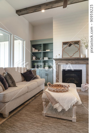 Beautiful living room interior with fireplace sofa upholstered table and cabinet 90959225