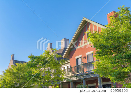 Terrace of a house with coral pink exterior and gray trims at Daybreak, South Jordan, Utah Terrace of a house with coral pink exterior and gray trims at Daybreak, South Jordan, Utah 90959303