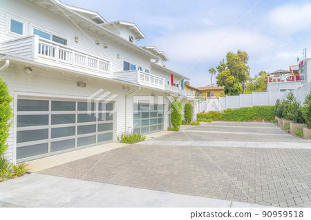 Townhomes exterior with white wood vinyl sidings at Carlsbad, San Diego, California 90959518
