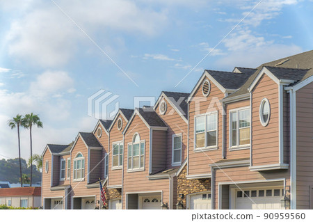 Townhouses with pink wood vinyl sidings at Carlsbad, San Diego, California Townhouses with pink wood vinyl sidings at Carlsbad, San Diego, California 90959560