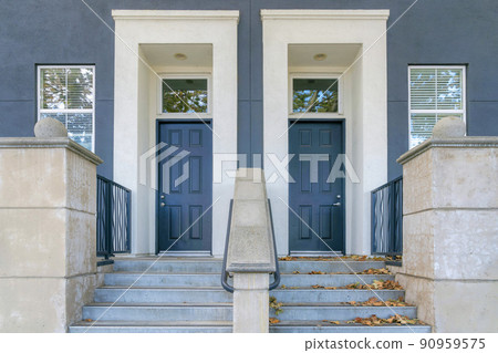 Two blue front doors with white doorframes and transom windows at San Jose bay area, California 90959575
