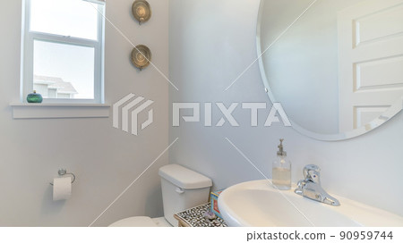 Pano Interior of a white bathroom with windows, mirror, sink and cabinet Pano Interior of a white bathroom with windows, mirror, sink and cabinet 90959744