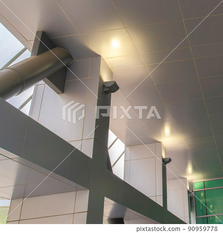 Square Light gray ceiling tiles and columns inside a building at Salt Lake City in Utah Square Light gray ceiling tiles and columns inside a building at Salt Lake City in Utah 90959778