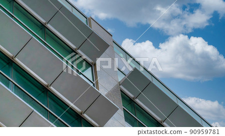 Panorama White puffy clouds Low angle view of a building with opened sunshade panels at Salt 90959781