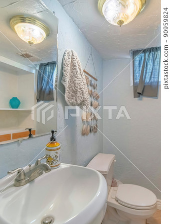 Vertical Interior of a bathroom with cabinets and wooden drawers Vertical Interior of a bathroom with cabinets and wooden drawers 90959824