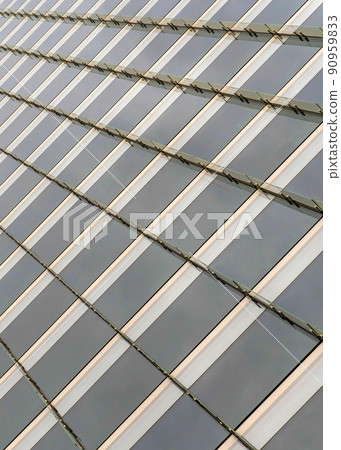 Vertical Tinted glass curtain wall of a building with vertical glass beams at Salt Lake City, Utah Vertical Tinted glass curtain wall of a building with vertical glass beams at Salt Lake City, Utah 90959833