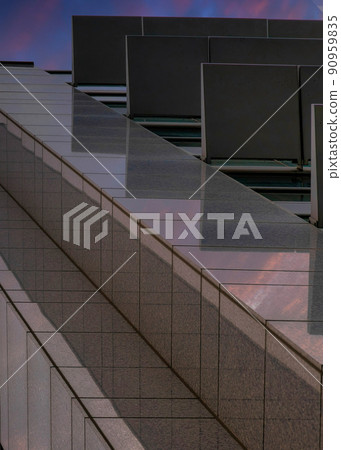 Vertical Dramatic sunset with clouds Corner of a high-rise building in a low-angle view at Salt Lake Vertical Dramatic sunset with clouds Corner of a high-rise building in a low-angle view at Salt Lake 90959835