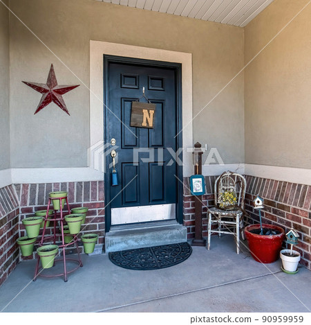 Square Front door exterior with decorative displays and pots Square Front door exterior with decorative displays and pots 90959959