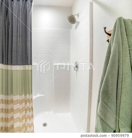 Square Shower stall of a bathroom with a tile pattern wall panel Square Shower stall of a bathroom with a tile pattern wall panel 90959979