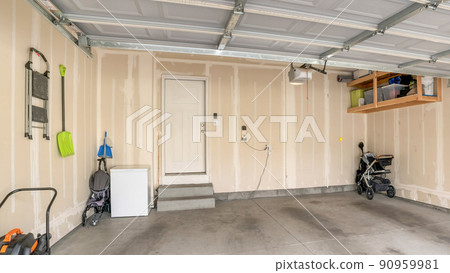 Panorama Garage interior with wall filler marks and white fire door 90959981