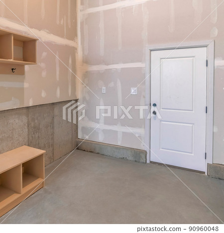 Square Unfinished mudroom interior with seat and shelving units Square Unfinished mudroom interior with seat and shelving units 90960048