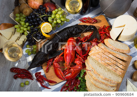 Still life with cooking seafood, wine, cheese and bread Still life with cooking seafood, wine, cheese and bread 90960684
