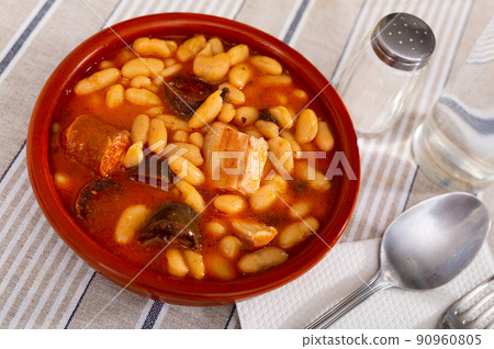 Traditional dish of Spanish cuisine is Fabada soup 90960805