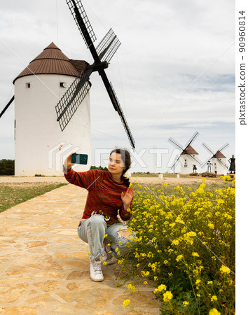 Woman tourist who came to Mota del Cuervo takes a selfie 90960814