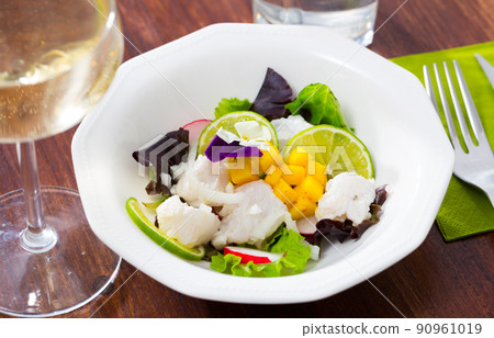 Hake ceviche with mango and lime Hake ceviche with mango and lime 90961019