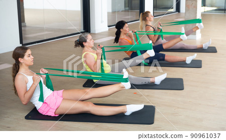 Group of women doing stretch exercises Group of women doing stretch exercises 90961037